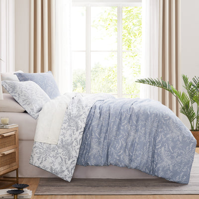 Side View of Wild Winter Reversible Comforter Set in Blue#color_wild-winter-blue-with-white-flowers