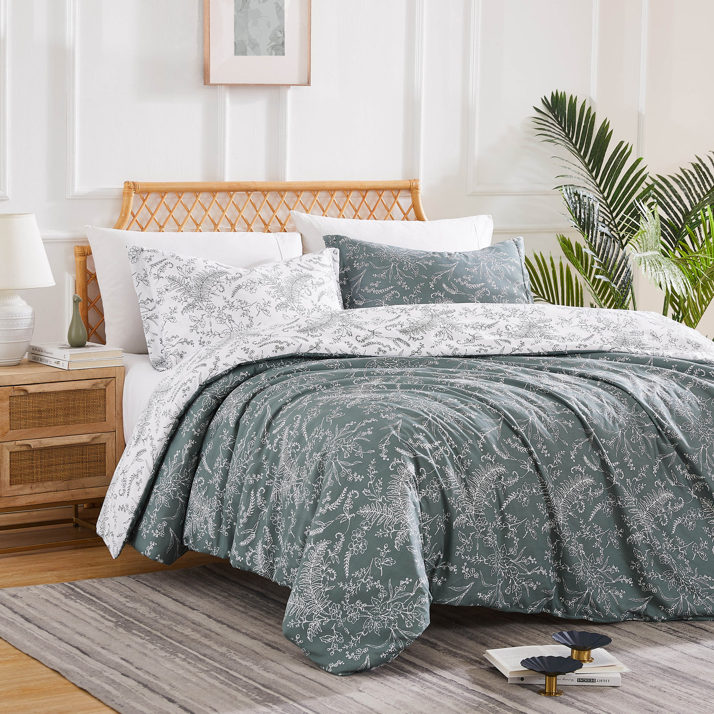 Angled View of Wild Winter Reversible Comforter Set in Teal#color_wild-winter-teal-with-white-flowers