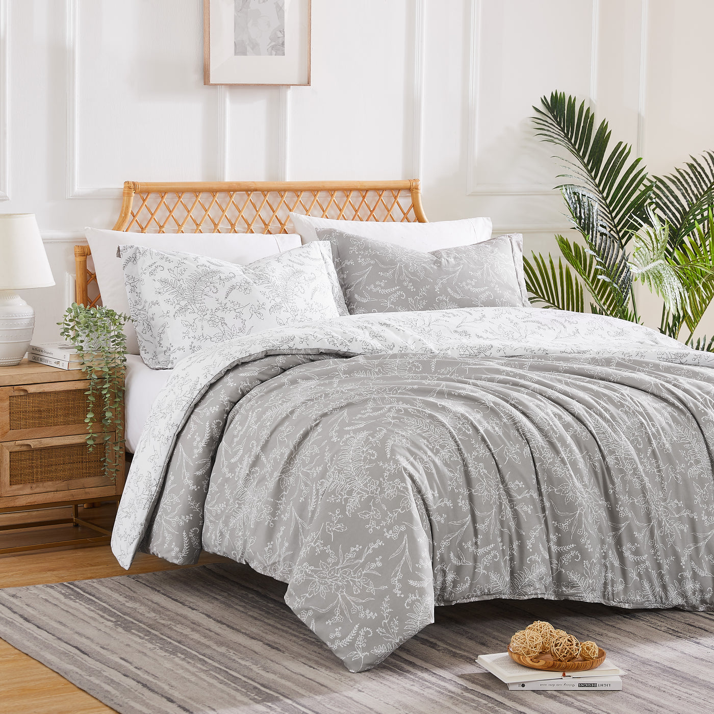 Angled View of Wild Winter Reversible Comforter Set in Grey#color_wild-winter-grey-with-white-flowers