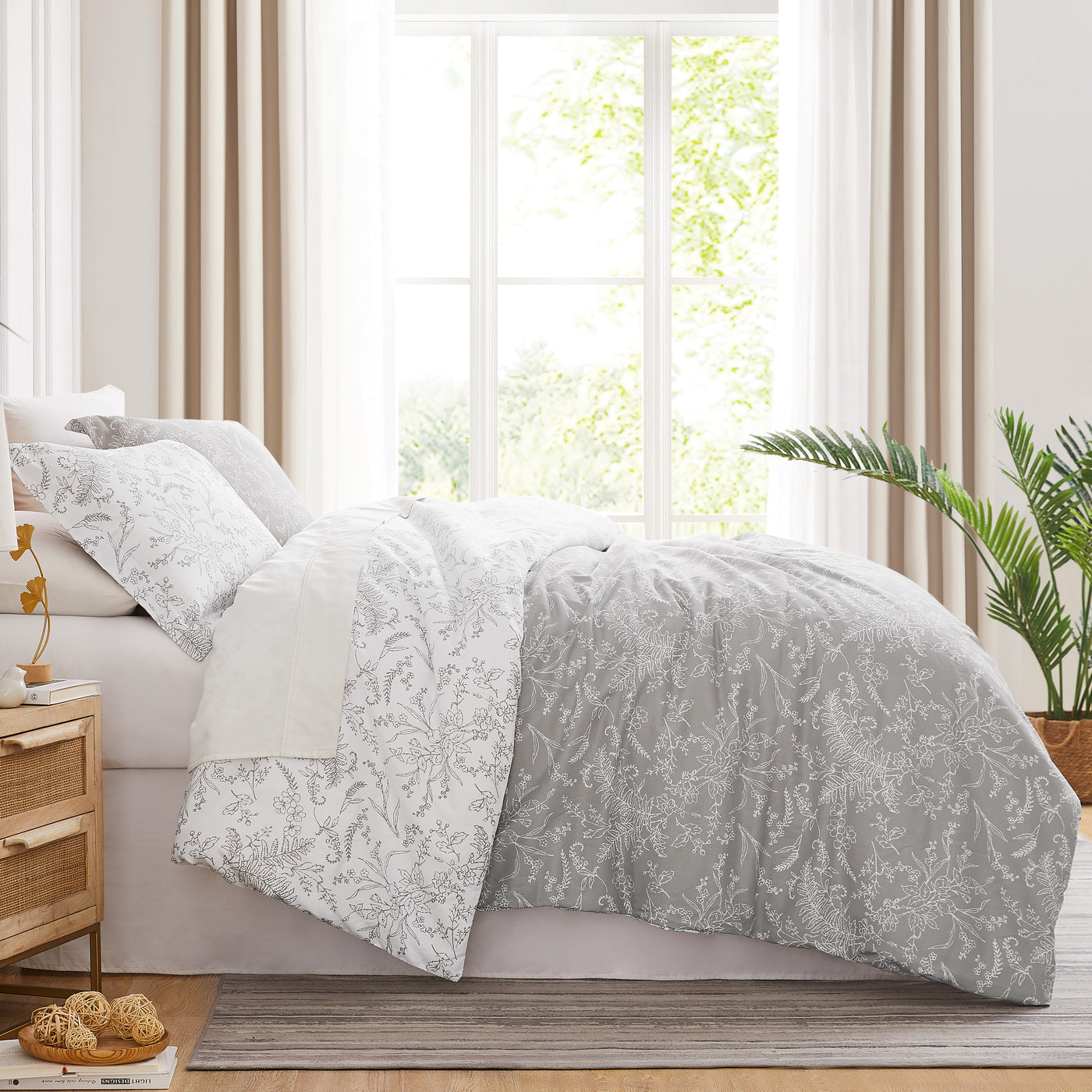 Side View of Wild Winter Reversible Comforter Set in Grey#color_wild-winter-grey-with-white-flowers