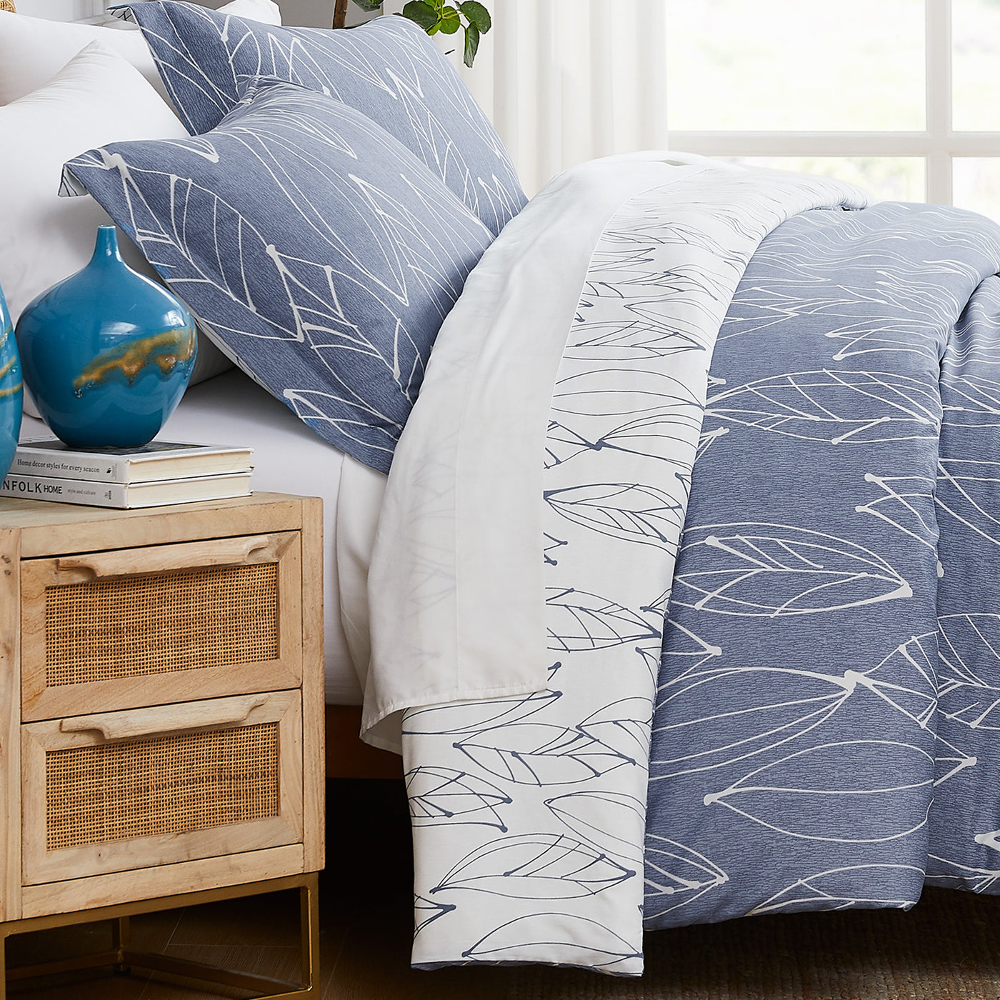 Side View of Contemporary Leaves Reversible Comforter Set in Blue#color_contemporary-leaves-blue