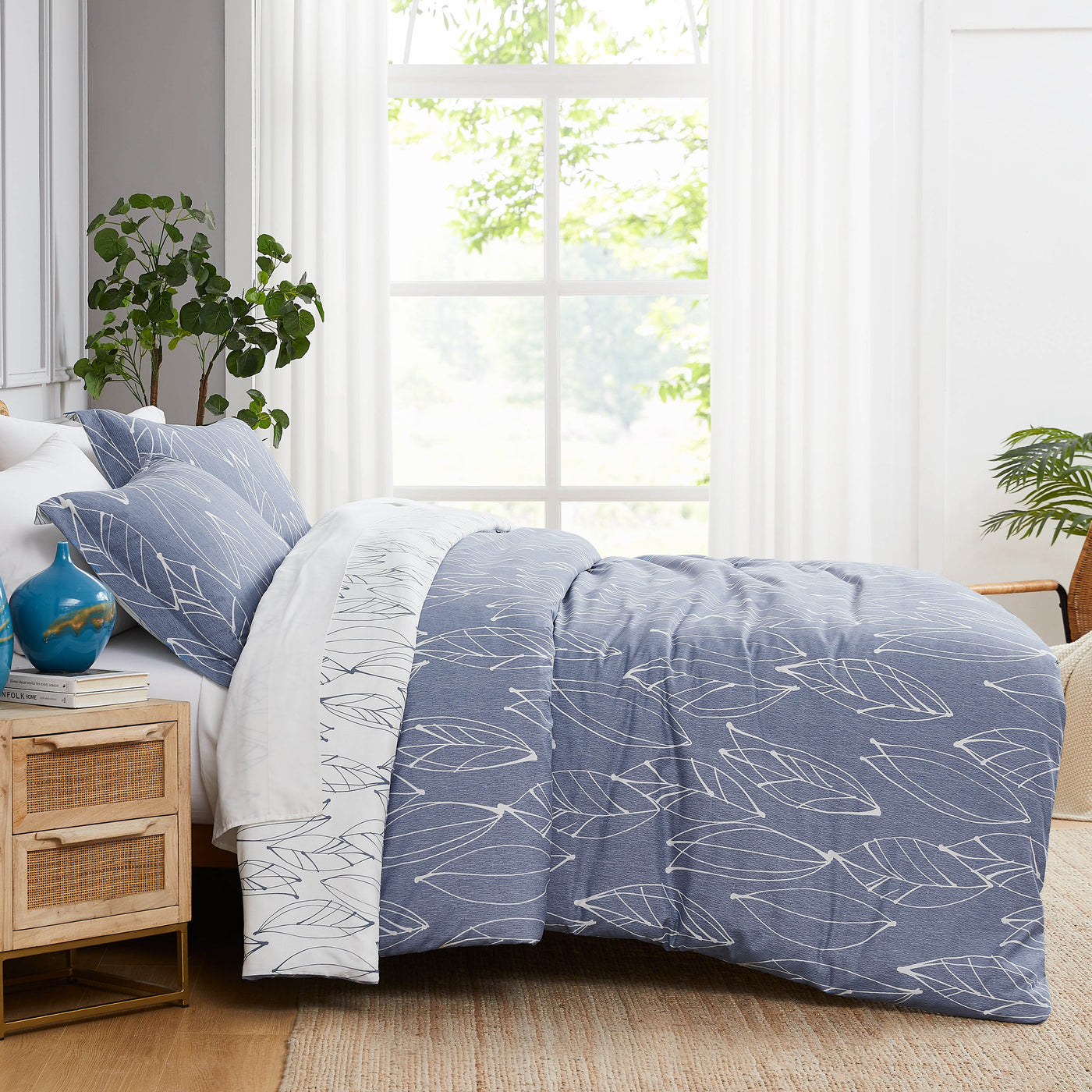 Side View of Contemporary Leaves Reversible Comforter Set in Blue#color_contemporary-leaves-blue