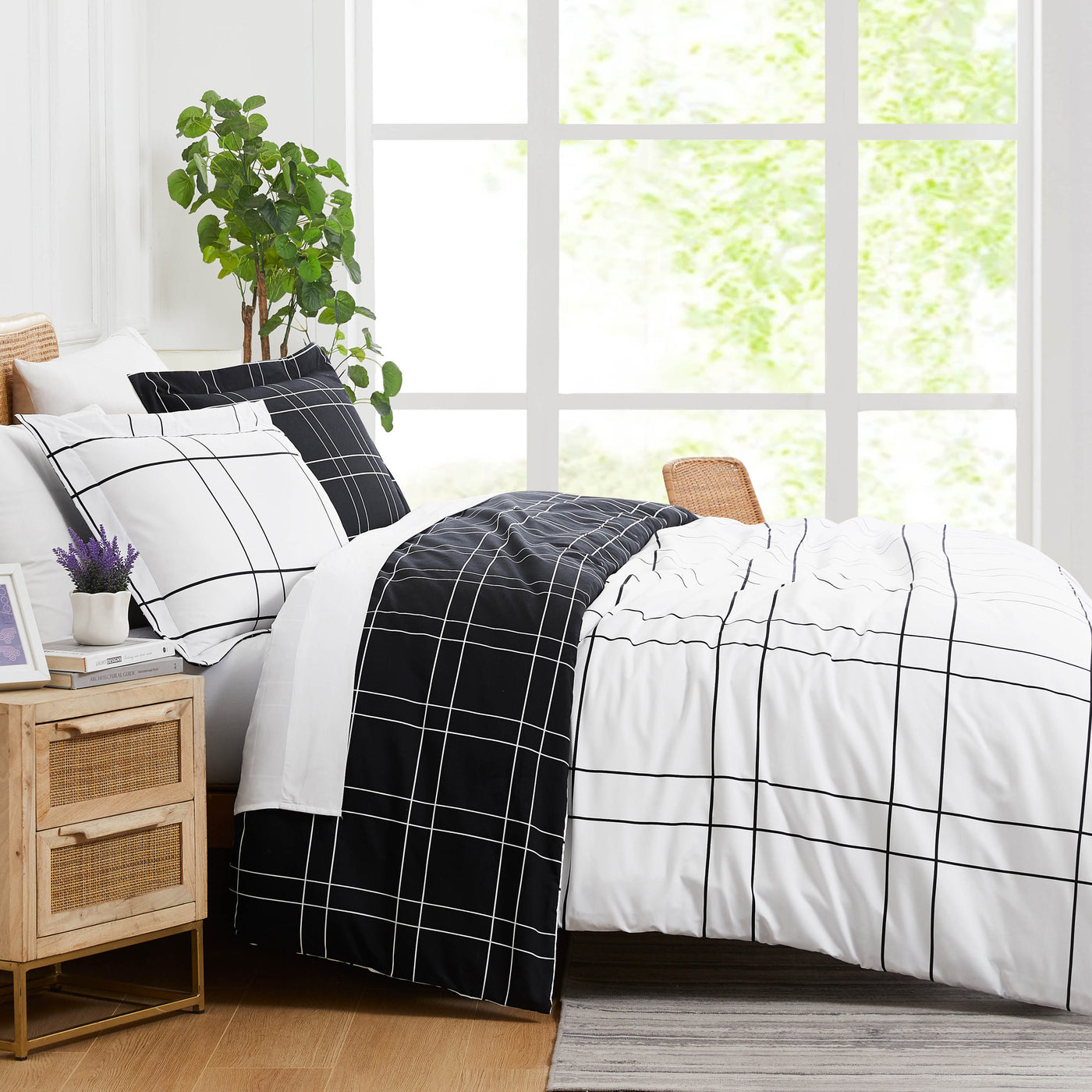 Side View of Modern Check Reversible Down Alternative Comforter Set in Black #color_modern-check-black