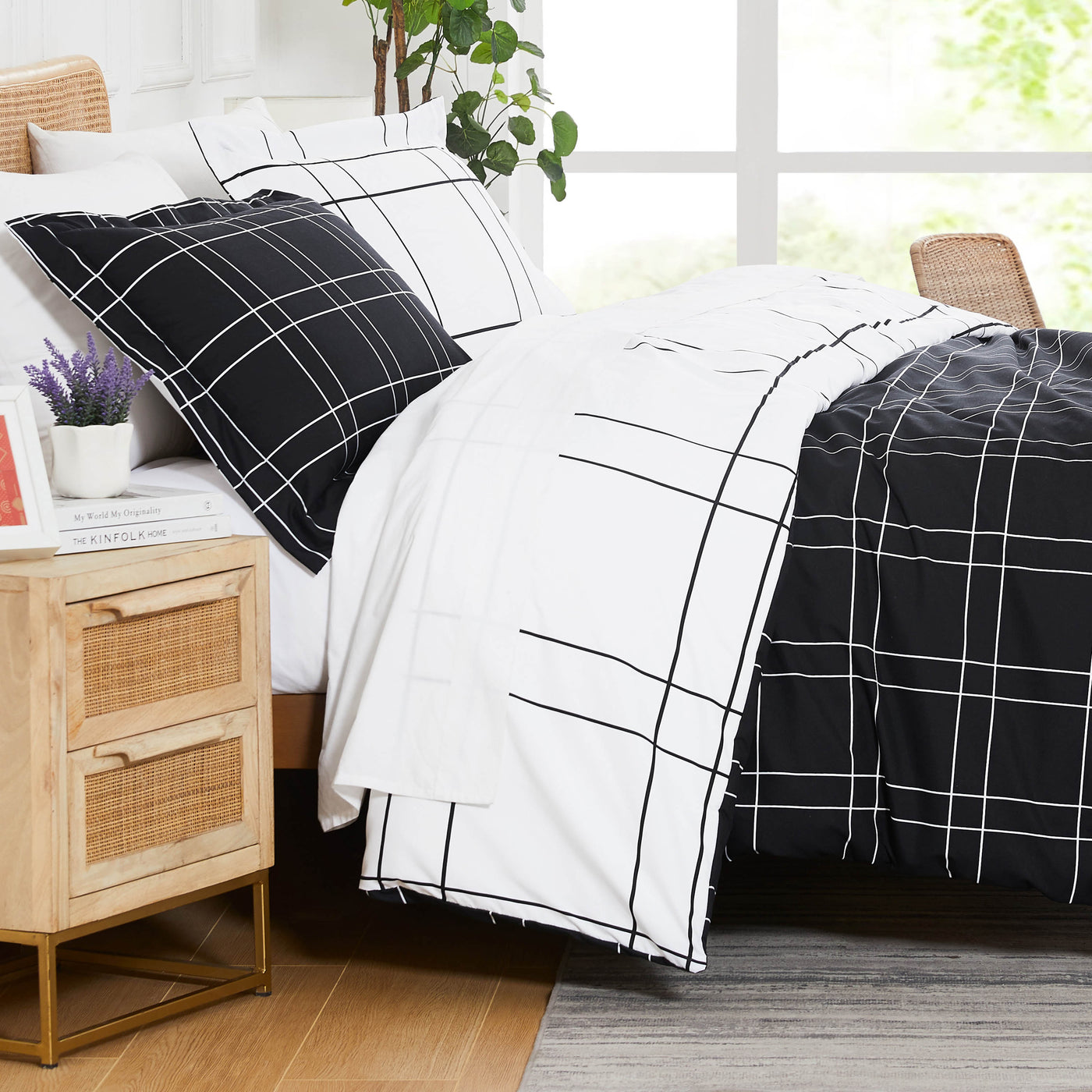 Side View of Modern Check Reversible Down Alternative Comforter Set in Black #color_modern-check-black