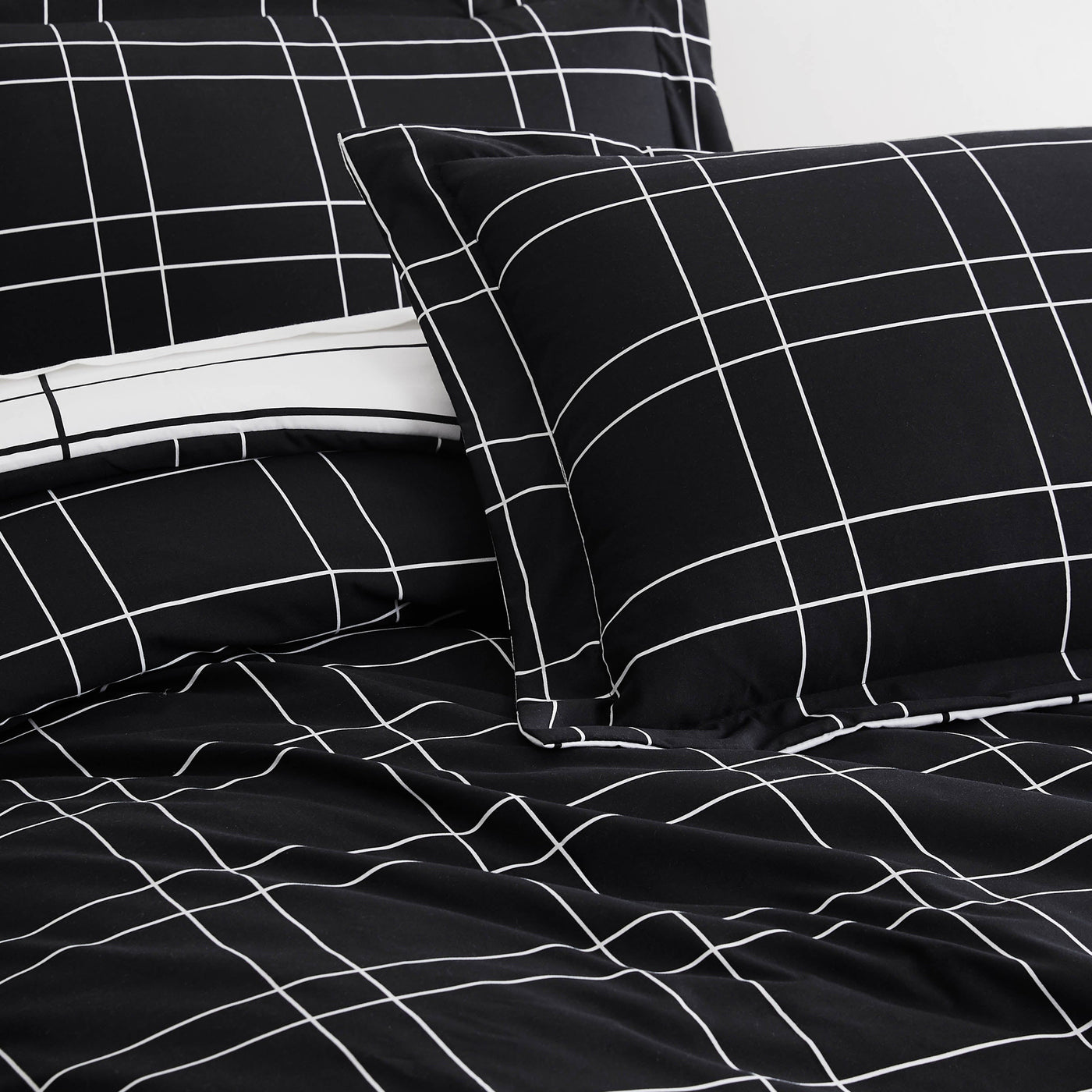 Details and Prints of Modern Check Reversible Down Alternative Comforter Set in Black #color_modern-check-black