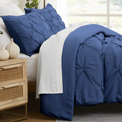 Side View of Pinch Pleated Pintuck Duvet Cover Set in Dark Blue#color_pintuck-dark-blue