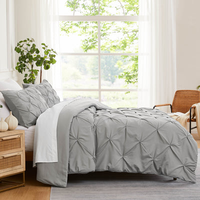 Side View of Pinch Pleated Pintuck Duvet Cover Set in Steel Grey#color_pintuck-steel-grey