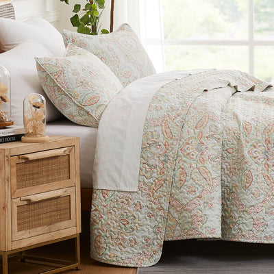 Side View of Bluebell Paisley Quilt Set in Coral Haze#color_bluebell-paisley-coral-haze