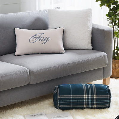 Close Up View of Vilano Plaid Pillow Shams in Blue on Sofa and Floor#color_plaid-blue