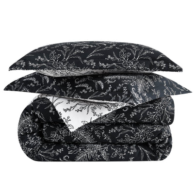 Side View of Wild Winter Reversible Comforter Set in Black#color_wild-winter-black-with-white-flowers