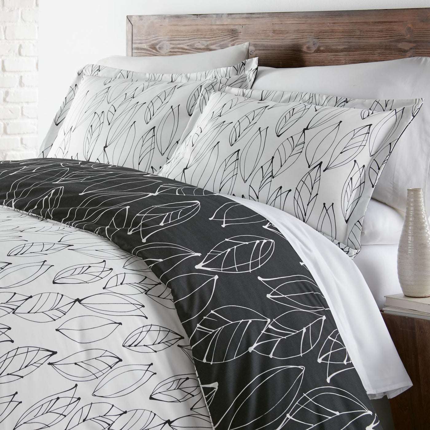 Angled View of Contemporary Leaves Reversible Duvet Cover Set in Black#color_contemporary-leaves-black