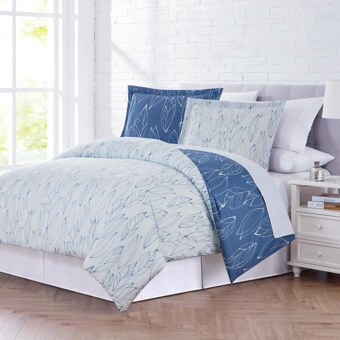 Angled View of Contemporary Leaves Reversible Duvet Cover Set in Grey#color_contemporary-leaves-blue