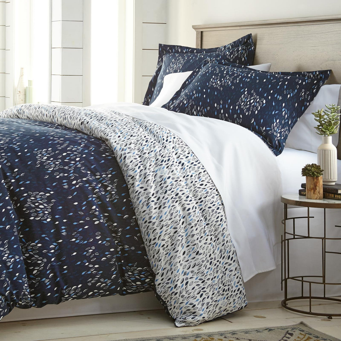 Angled View of Fall for Me Reversible Duvet Cover Set in Blue#color_fall-for-me-blue