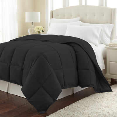 Angled View of Down Alternative Comforter in Black#color_black