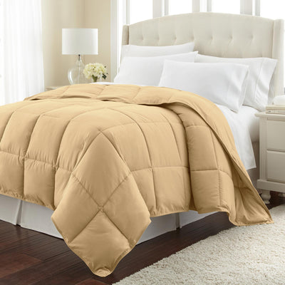 Angled View of Down Alternative Comforter in gold#color_gold