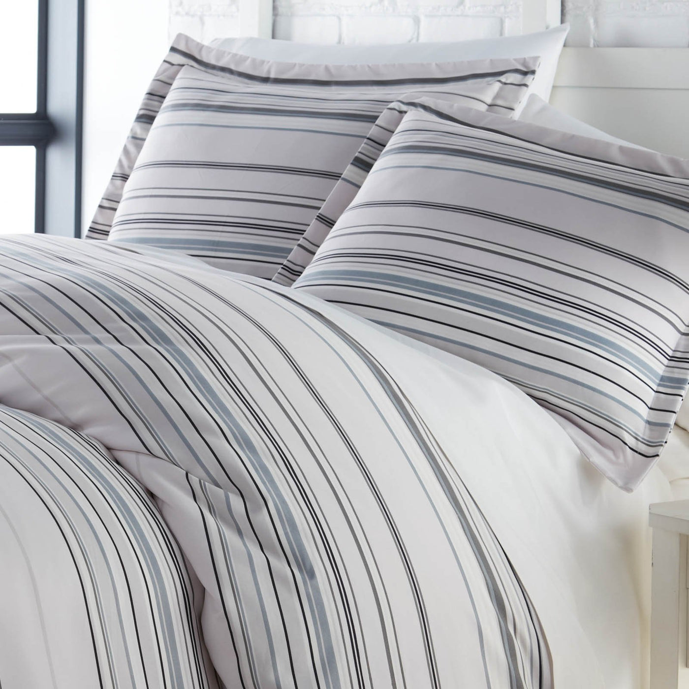 Angled View of Malibu Dreams Duvet Cover Set in Grey#color_malibu-dreams-grey